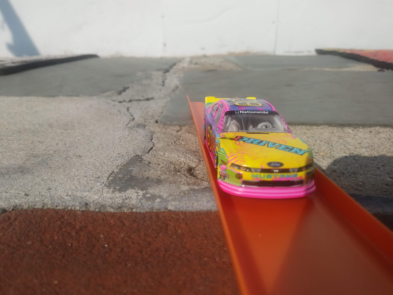 They really went hard on the pastel colors on the diecast. Pepto-pink trim. Yellow spoiler. Even “Mustang” is written in a bright blue color; none of these coloration details, nor the star pattern on the hood, made it to the car, but I wonder if they were meant to.